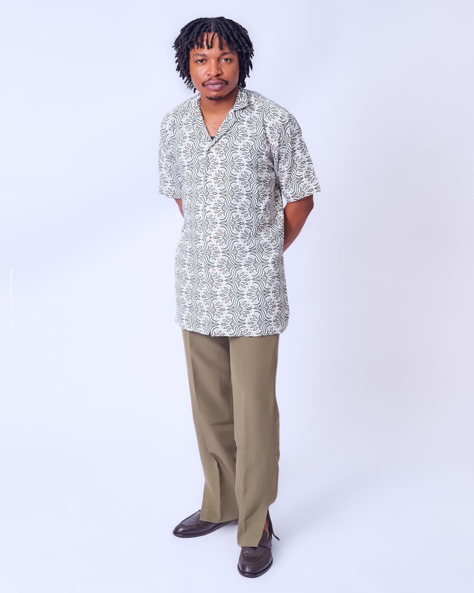A man wearing a relaxed shirt and straight pants